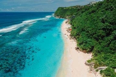 Paradise beach with turquoise ocean in Bali. Aerial view clipart