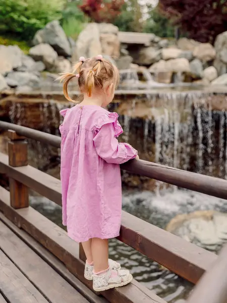 Little Child Girl Stylish Dress Walking Summer Park Looking Waterfall Imágenes De Stock Sin Royalties Gratis