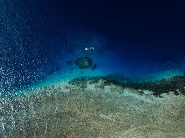 stock image Seascape aerial drone view over coral reef with boats in Bali