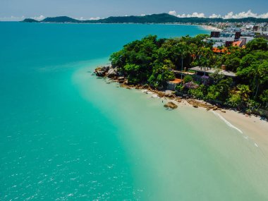 Luxury holiday beach with villas and turquoise quiet ocean in Brazil. Aerial view clipart