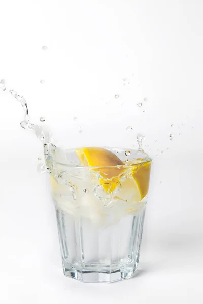 stock image Glass of lemonade with splashing water on white background drink isolated healthy fresh drink concept