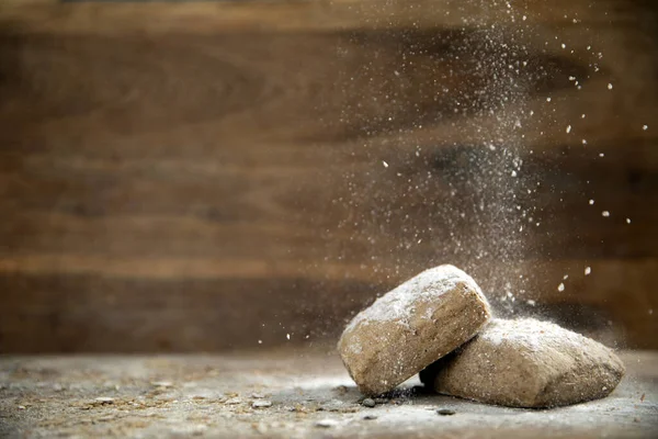 Fresh Baked Whole Grain Bread Wooden Background Falling Flour Copy — стоковое фото