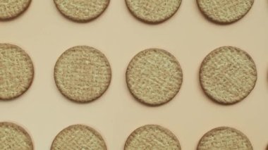 seamless looping animation of normal freshly baked healthy grain cookies in a row of homemade pastries animated on a colorful background. Healthy crunchy oatmeal cookies top view vegan