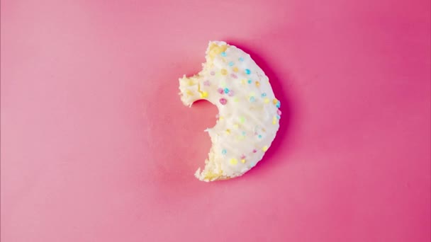 Eating Delicious Sweet Donut Colorful Sprinkles Pink Background Timelapse Bakery — Vídeos de Stock
