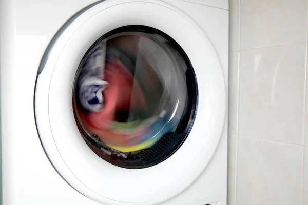 Close Washing Machine Door Multicolored Clothes Rotating Copy Space Washing — Stockfoto