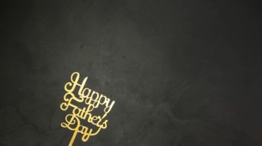 Dad text gold shiny letters on black concrete background, Happy Fathers Day Greeting gold effect on dark background copy space, moving from left to right with King crown 4k
