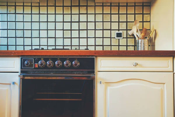 Vintage retro kitchen with green pattern tiles, american retro kitchen home interior design 70\'s 80\'s style close-up. retro background