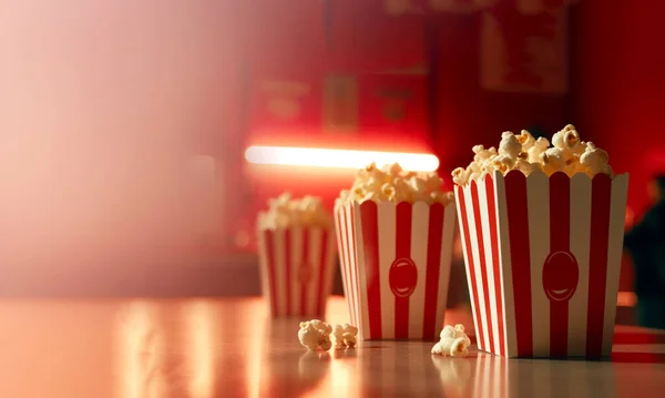 Movie, red and white striped popcorn, Box. with delicious popcorn in Cinema or movie theatre bokeh background with copy space, Film,video snack, fast food concept space for text