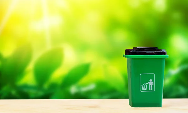 Green garbage for organic biodegradable waste, separate waste collection and recycling concept with nature background, environment concept copy space space for text