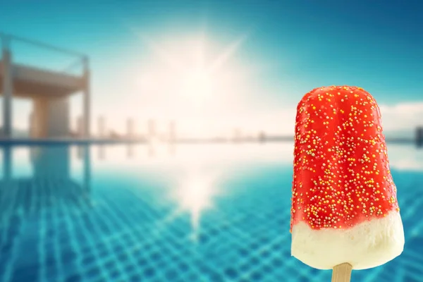 Bright fruit ice cream on a stick on a summer concept background. Frozen fruit ice. Summer mood. Cooling dessert in hot weather. Favorite delicacy for children. Homemade raspberry, strawberry