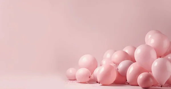 Balloons on pastel pink background. Frame made of white and pink balloons. Birthday, holiday concept. Flat lay, top view, copy space pastel pink colored