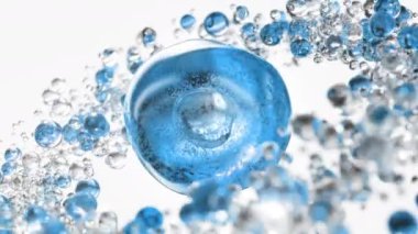 Soyut arka planda sıvı kabarcıkları olan mavi kozmetik serumu. Kolajen molekülleriyle zenginleştirilmiş hidratlaştırıcı özlü jel. Gelişmiş cilt bakımı, güzellik ve cilt sağlığı için nemlendirici krem veya yağ.