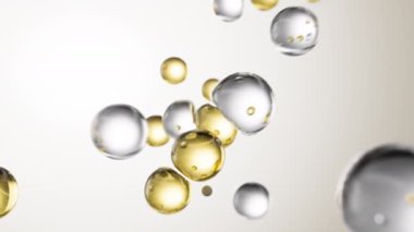 Soyut arka planda sıvı kabarcıkları olan altın kozmetik serumu. Kolajen molekülleriyle zenginleştirilmiş hidratlaştırıcı özlü jel. Gelişmiş cilt bakımı, güzellik ve cilt sağlığı için nemlendirici krem veya yağ.