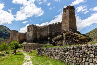Khertvisi Fortress, Georgia, stone medieval castle with watchtowers and citadel on a green rocky hill in Lesser Caucasus mountains in Samtskhe - Javakheti (Meskheti) region.