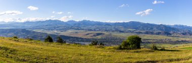Potskhovi river valley panorama in Samtskhe - Javakheti region with Akhaltsikhe town, Georgia with Lesser Caucasus mountains in the background, summer.