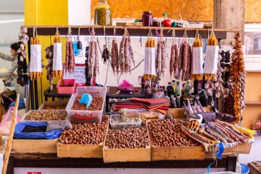 Kutaisi, Georgia, 04.06.21. Market stall in Kutaisi Central Market (Green Bazaar, Mtsvane Bazari) with churchkhela, traditional Georgian candy, Chiri, Georgian sweets and hazeltuts.