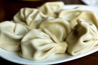 Khinkali, Gürcistan 'ın ulusal yemeklerinden biri olan et ve baharatla doldurulmuş bükülmüş hamur toplarından oluşan popüler Gürcistan hamur tatlısı..