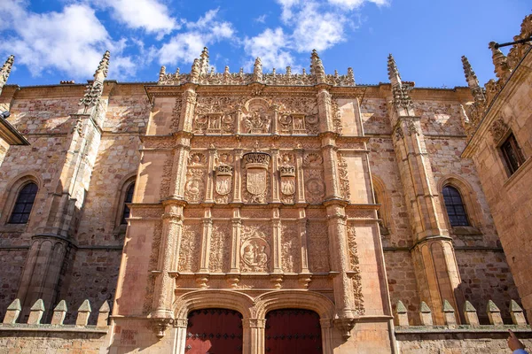 Stock image University of Salamanca, front stone Plateresque facade of Escuelas Mayores building with decorative reliefs and figures, main entry gate.