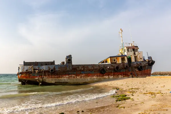 Cargo ship wreck run aground on the Al Hamriyah beach in Umm Al Quwain, United Arab Emirates.