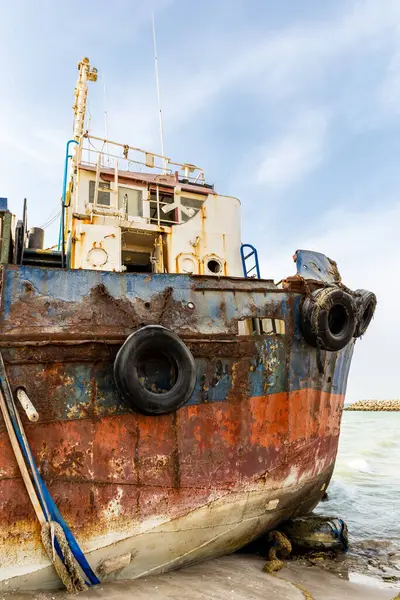 Cargo ship wreck washed ashore on the Al Hamriyah beach in Umm Al Quwain, United Arab Emirates.