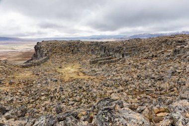 Borgarvirki columnar basalt Viking fortress and a volcanic plug on the Vatnsnes peninsula in northwest Iceland, landscape view of rock formations on the hill. clipart