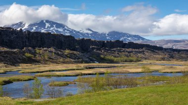 Thingvellir National Park and Logberg (Law Rock) landscape, site of the Althing parliament, valley with pools, water streams and mountains in the background. clipart