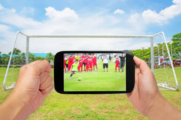 Man Use Mobile Motion Blur Kids Playing Soccer Football Match — Fotografia de Stock