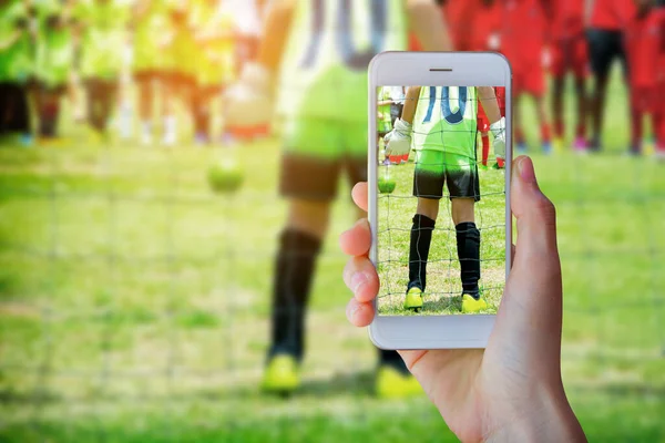 Hand Holding Smartphone Young Boy Soccer Goalkeeper Football Match Ready — Fotografia de Stock