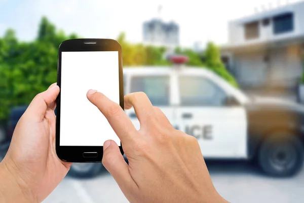 Älypuhelin Poliisiautolla — kuvapankkivalokuva