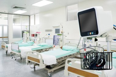 Digital vital signs of measuring heart and blood pressure monitor with elderly patient sleep on the bed in hospital room.