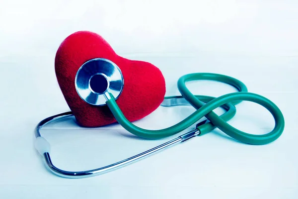 Green Stethoscope Doctor Hand Red Heart Isolated Wooden White Background — Foto Stock