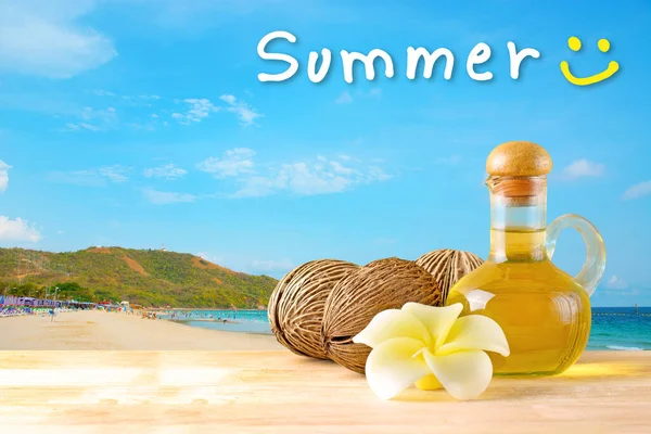 Compress with olive oil, pong pong seed or othalanga and soap in soft tone on wooden table with the beach backgroud, natural ,spa and summer time concept.