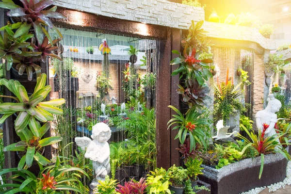 Water fall with green forest in the department store.