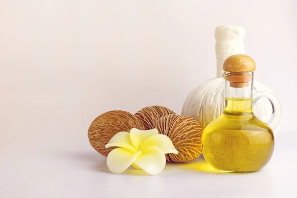 Compress with olive oil, pong pong seed or othalanga and soap in soft tone backgroud, spa concept