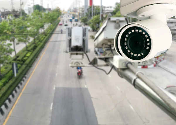 CCTV camera pointing on the road blurred background. artificial intelligence . secutity concept .