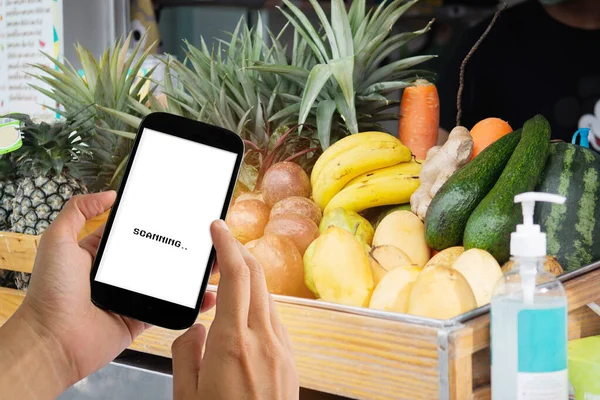 Customer using digital mobile phone scan QR code payment for buying fruit, express delivery, digital payment technology and fast food delivery concept