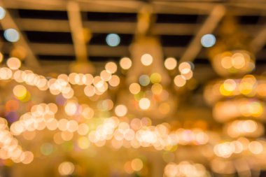 Gold bokeh lights and gold shiny sparkles background.
