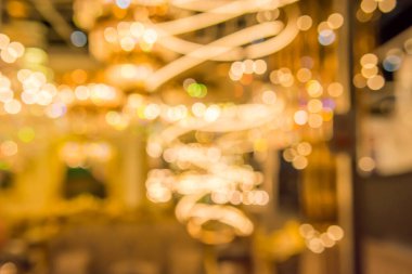 Gold bokeh lights and gold shiny sparkles background.