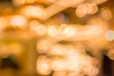 Gold bokeh lights and gold shiny sparkles background.