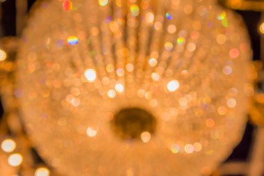 Gold bokeh lights and gold shiny sparkles background.