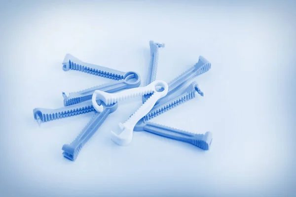 Blue tone of umbilical cord clamp used to clamp off the umbilical cord after a baby's birth.