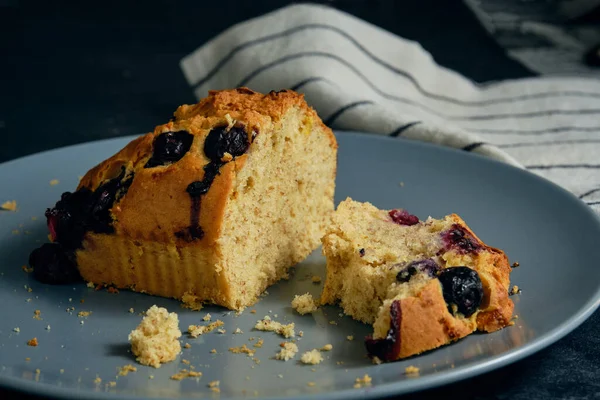 stock image cut sponge cake with blueberries on a plate