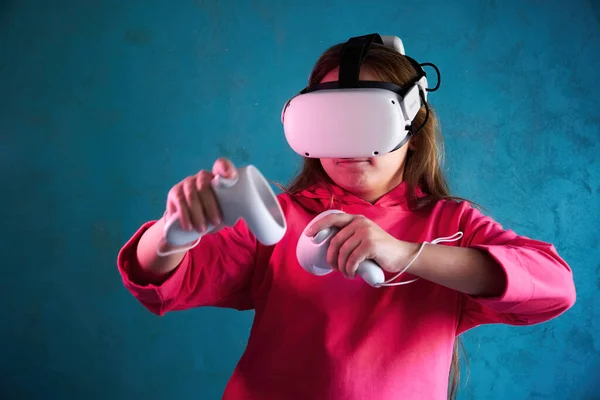 little girl playing with virtual reality glasses