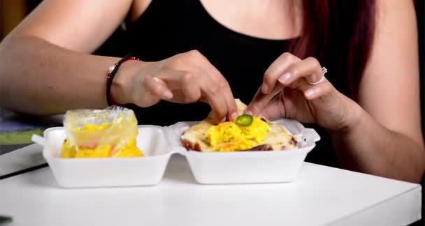 Woman Sits Eats Cheese Pupusa Curtido She Seems Enjoy Tangy — Wideo stockowe