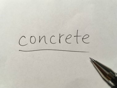 Kağıt arkaplanda somut kavram kelimesi