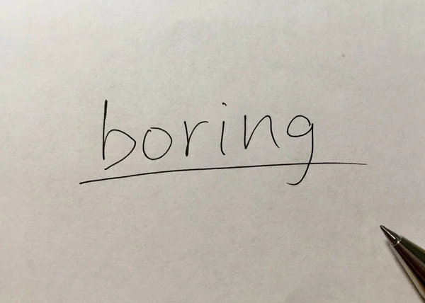 Boring concept word on paper background