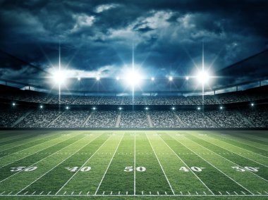 IIIuminated American Football Stadium at night with empty field. clipart