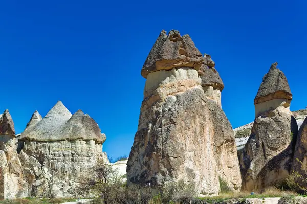 Cappadocia landscape soft volcanic rock, shaped by erosion into towers.