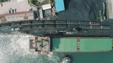 Electric locomotive with freight cars or railway wagon rides on railroad in Zonguldak.