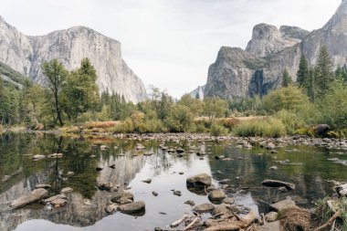 Scenic panoramic view of famous Yosemite Valley with El Capitan rock . High quality photo clipart
